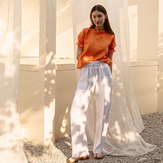 Orange linen top with puffed sleeves and ruffles 