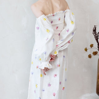 Back view white linen off the shoulder dress with pansies print