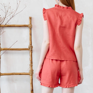 Back view coral pink linen shorts with frills