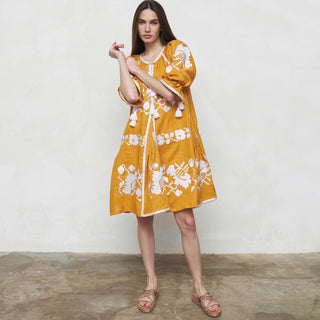 Yellow linen dress with bold floral embroidery