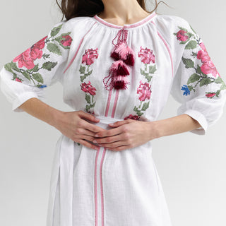 White linen dress with embroidery and tassels