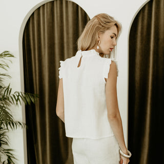 Back view white linen sleeveless top with frills