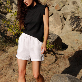 White linen shorts with side pockets